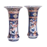 A pair of Imari pierced beaker vases