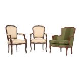 A pair of stained beech armchairs