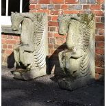 A pair of carved stone table ends