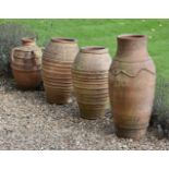 A pair of terracotta baluster garden vases