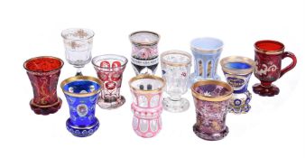 A group of nine Bohemian coloured glass beakers