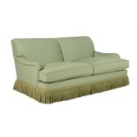 A green upholstered sofa in late 19th century taste by Kingcome sofas