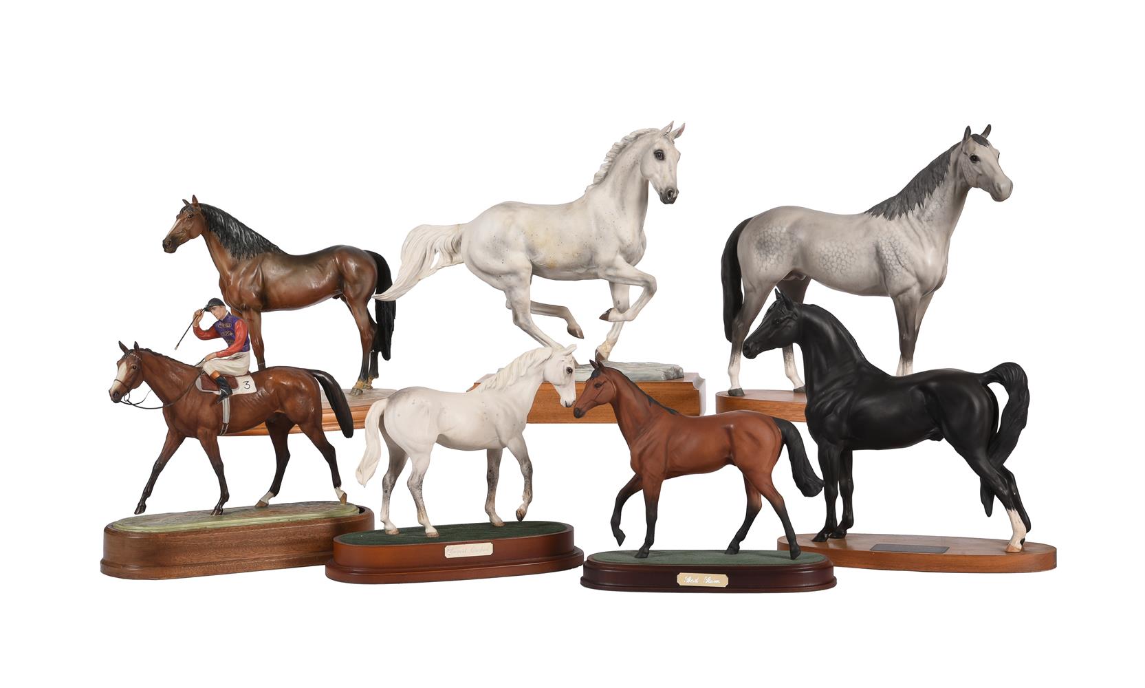 A collection of seven various ceramic equestrian models