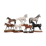 A collection of seven various ceramic equestrian models