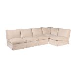 A white upholstered corner sofa