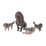 A group of bronze figures of dogs