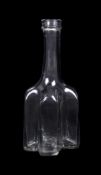 An English cruciform clear-glass decanter or serving bottle