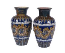 A pair of Doulton Lambeth stoneware shouldered ovoid vases by George Tinworth