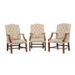 A set of three mahogany and upholstered armchairs in George III style