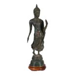 A Sukotai style bronze figure of the walking Buddha