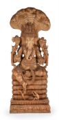 A monumental carved wood figure of Ganesha