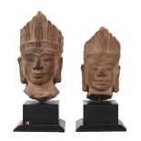 Two Khmer style sandstone heads of male deities