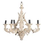 A distressed white painted six light chandelier