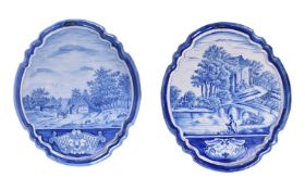 Two similar Dutch Delft blue and white shaped oval wall-plaques