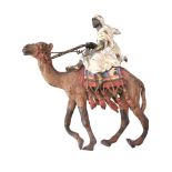 A cold painted bronze group of an Arab on a camel