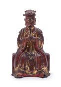 A Chinese bronze lacquered and gilt figure of a seated bearded Official