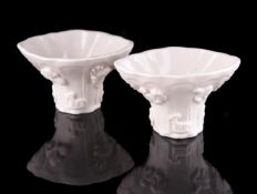 A very fine and rare pair of Chinese small Blanc de Chine libation cups of rhinoceros horn form