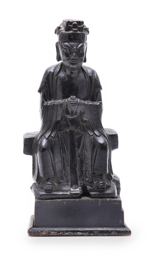 A Chinese bronze figure of a seated scholar