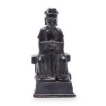 A Chinese bronze figure of a seated scholar