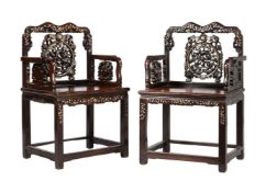 A pair of Chinese carved hardwood and mother of pearl armchairs