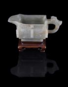 A Chinese celadon jade archaic style pouring vessel