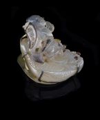 An attractive carved agate carving of a 'boy riding on a fish'