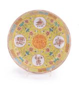 A small Chinese Famille Rose yellow-ground dish