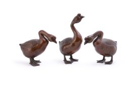 Three amusing Japanese bronzed spelter models of Geese