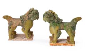 A pair of Chinese pottery green glazed Guardian Lions