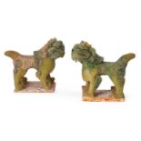 A pair of Chinese pottery green glazed Guardian Lions