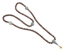 A Chinese jadeite and possibly aloeswood necklace