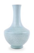 A Chinese carved celadon-glazed bottle vase