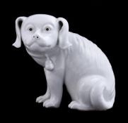 A Chinese white-glazed model of a dog