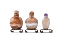 Y Three Chinese banded agate snuff bottles