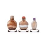 Y Three Chinese banded agate snuff bottles