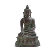 A Tibetan bronze figure of Buddha