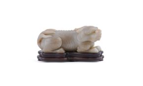 A Chinese celadon jade carving of lion
