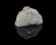 A small Chinese pale celadon jade carving of a man and boy