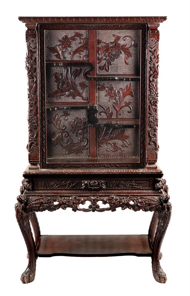 A Japanese carved hardwood cabinet