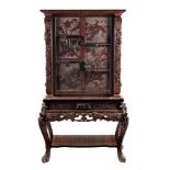 A Japanese carved hardwood cabinet