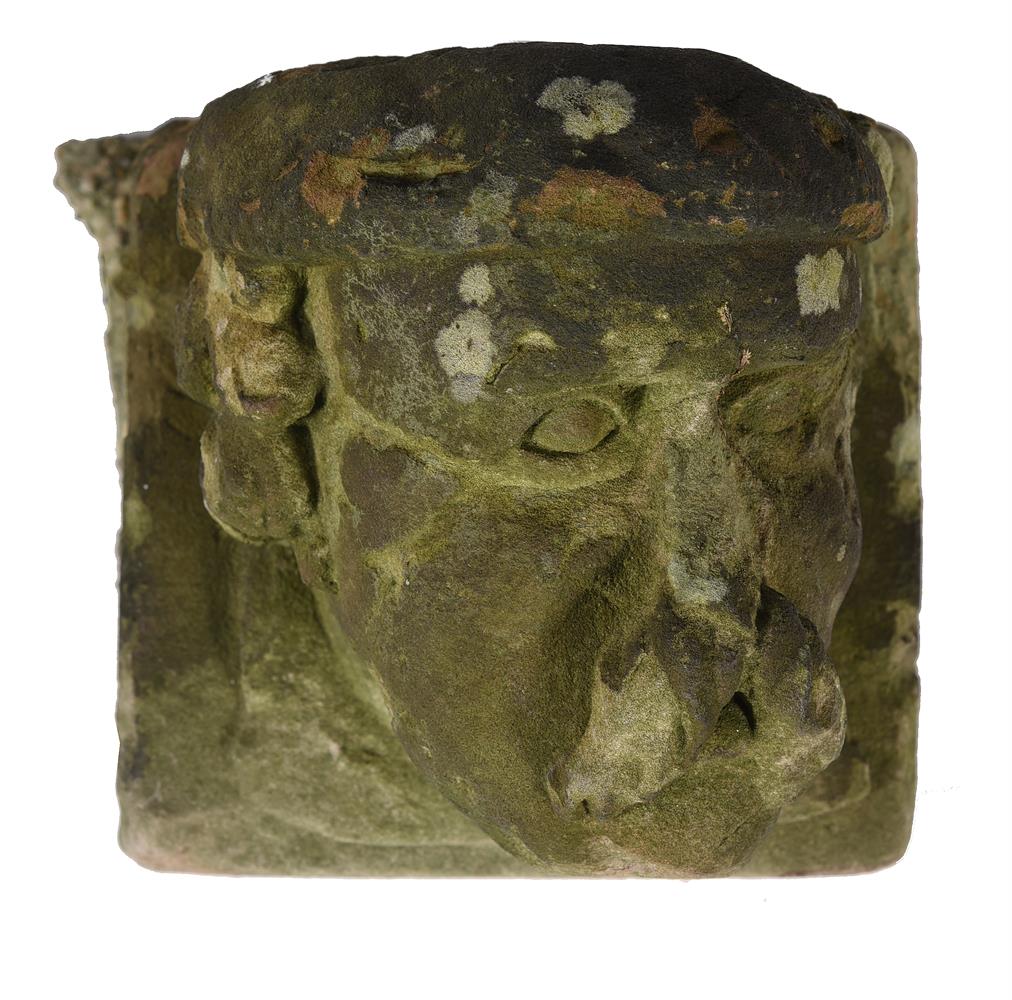 A Continental, probably German, carved stone corbel head