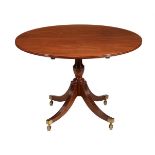 A mahogany centre table in George III style