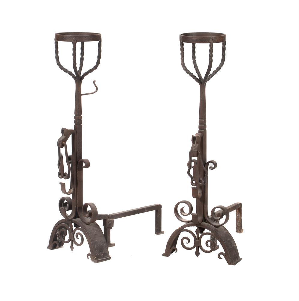 A pair of wrought iron andirons in late 17th century taste