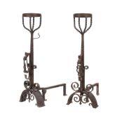 A pair of wrought iron andirons in late 17th century taste