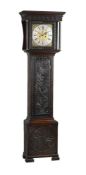 A carved oak longcase clock
