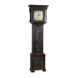 A carved oak longcase clock