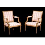 A pair of French giltwood armchairs