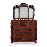 A Japanese carved exotic hardwood cabinet with tryptic mirrored top