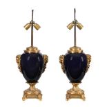 A pair of blue porcelain and gilt metal mounted table lamps