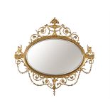 A giltwood and composition oval wall mirror